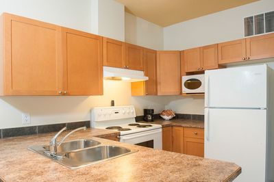 Suite Full Kitchen at Podollan Rez-idence Fort McMurray